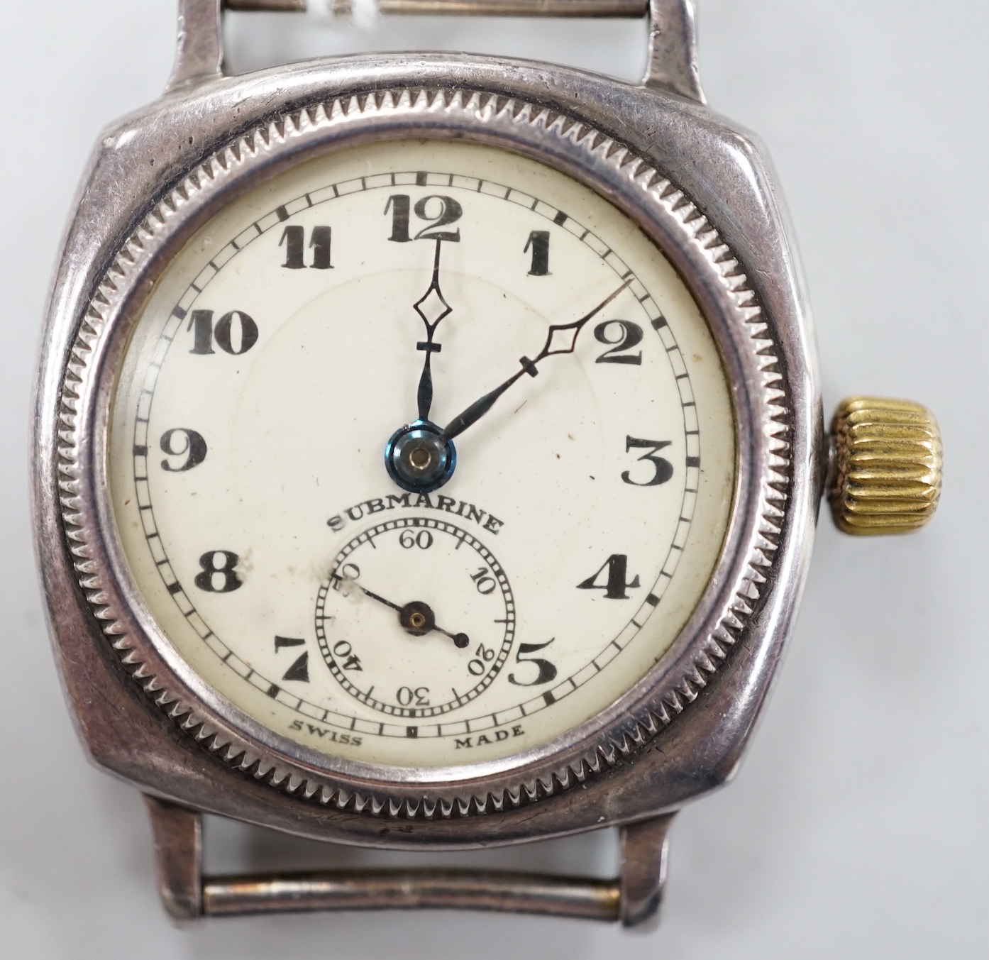 A 1930's? silver manual wind wrist watch, the dial inscribed 'Submarine', with subsidiary seconds, case diameter 30mm, no strap.